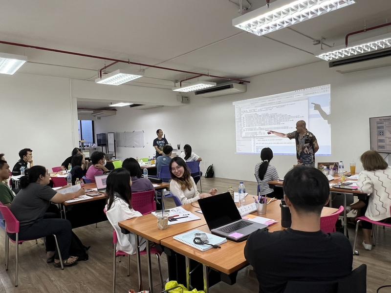 Prathan teaching a Holistic Testing class in person to participants